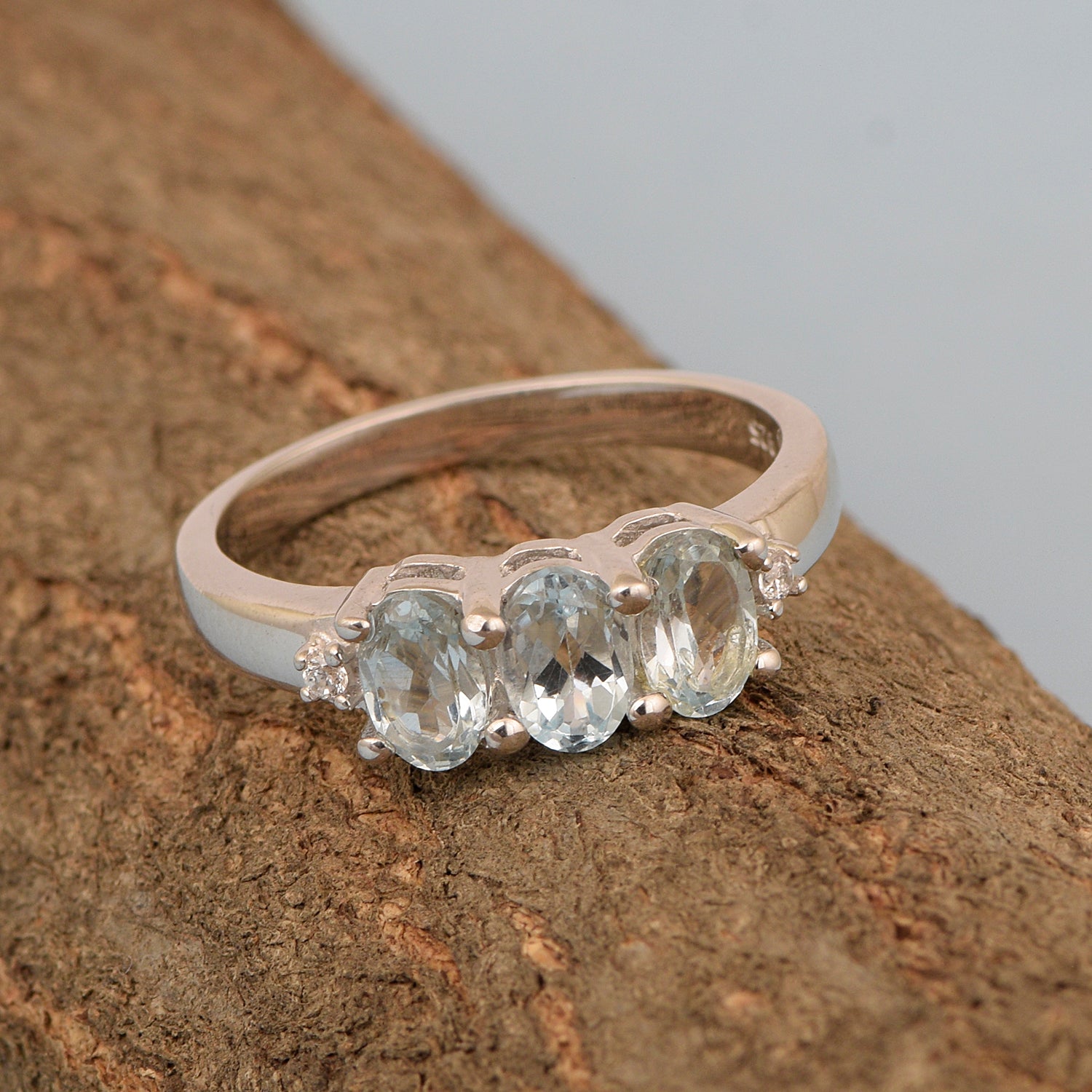 925 Sterling Silver Three-Stone Oval 1.35 Ctw Blue Topaz Women's Ring - Kimaya INC