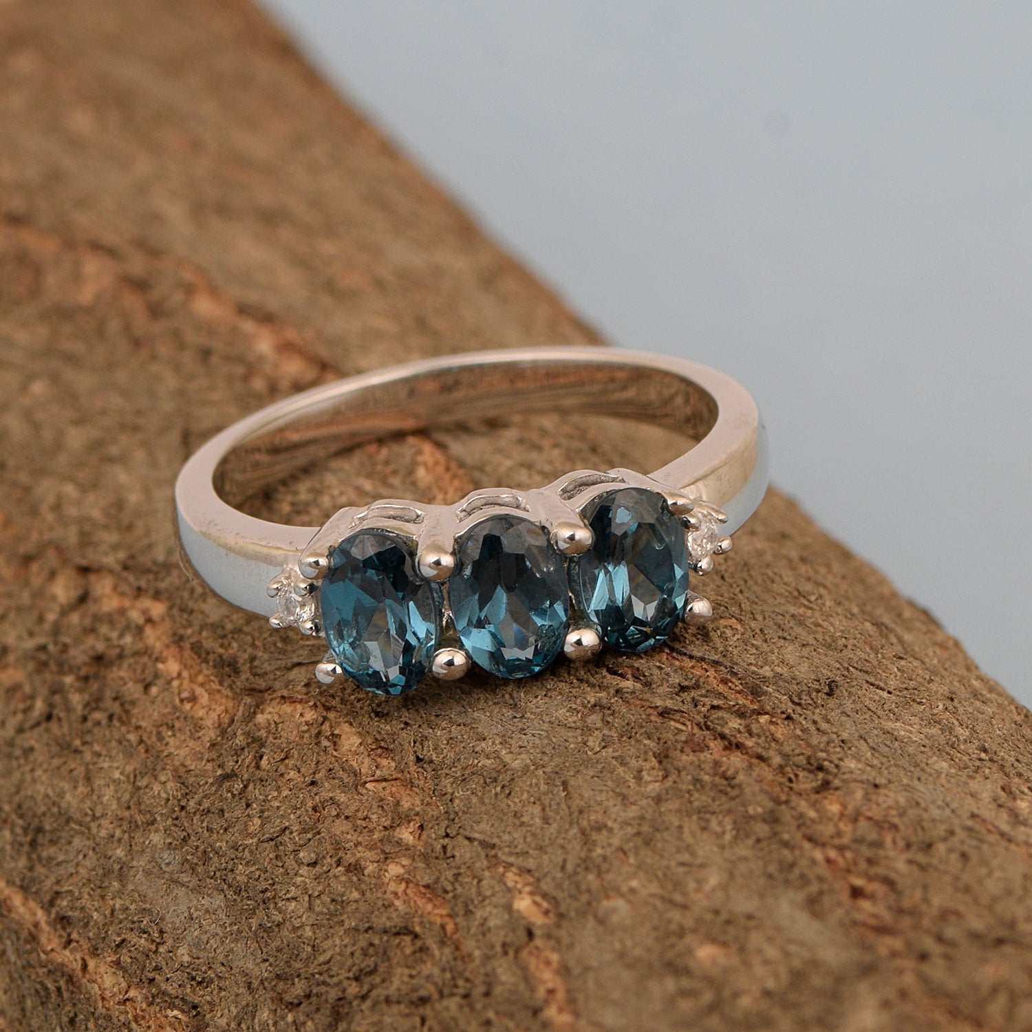 925 Sterling Silver Three-Stone Oval 1.35 Ctw London Blue Topaz Women's Ring - Kimaya INC